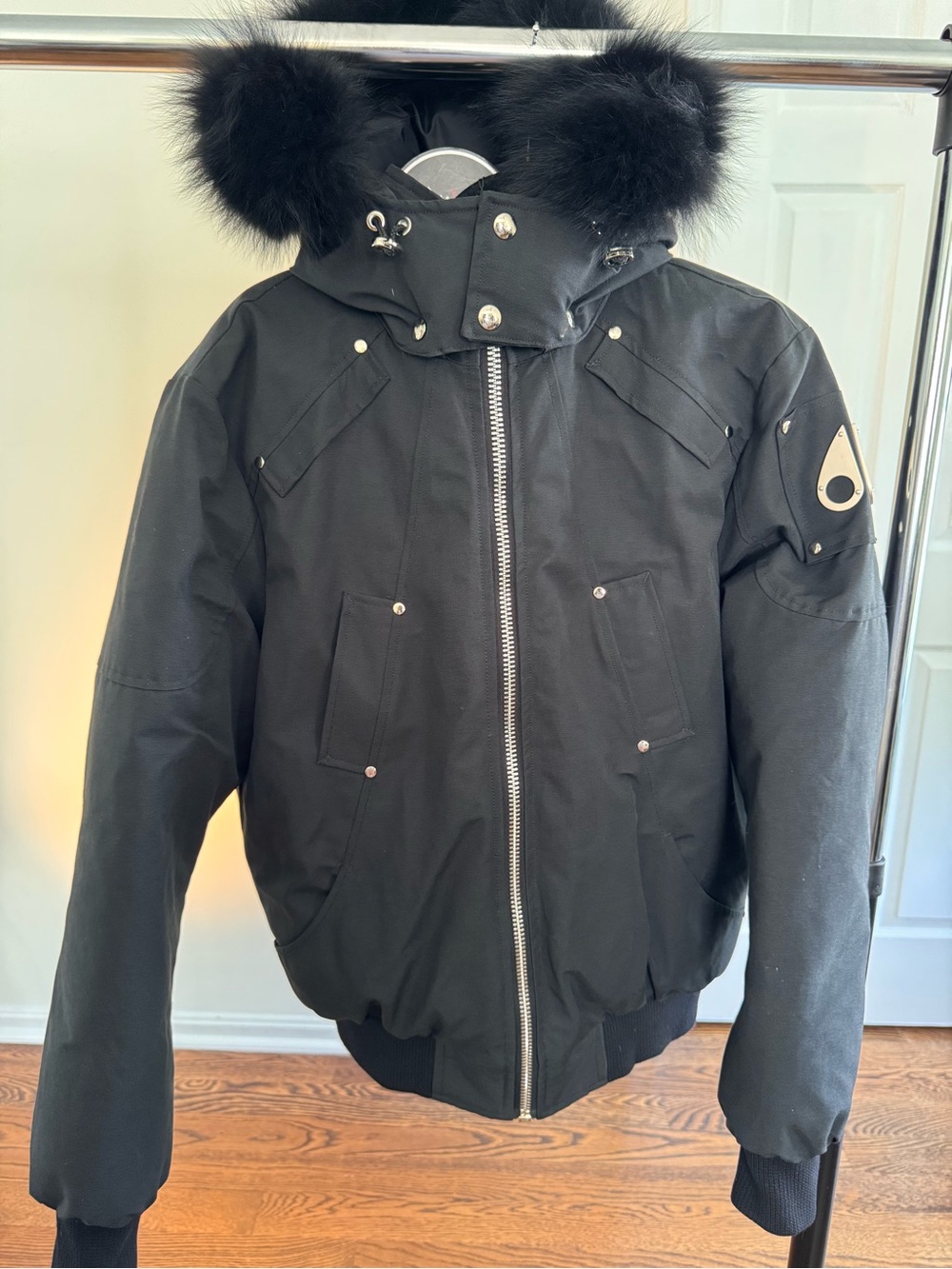 Moose Knuckles Black Jacket with Red & White Embroidered Patch